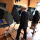 People use electronic voting machines to cast their ballot in the midterm elections at Neighborhood Congregational Church in Laguna Beach, California on election day in 2018.